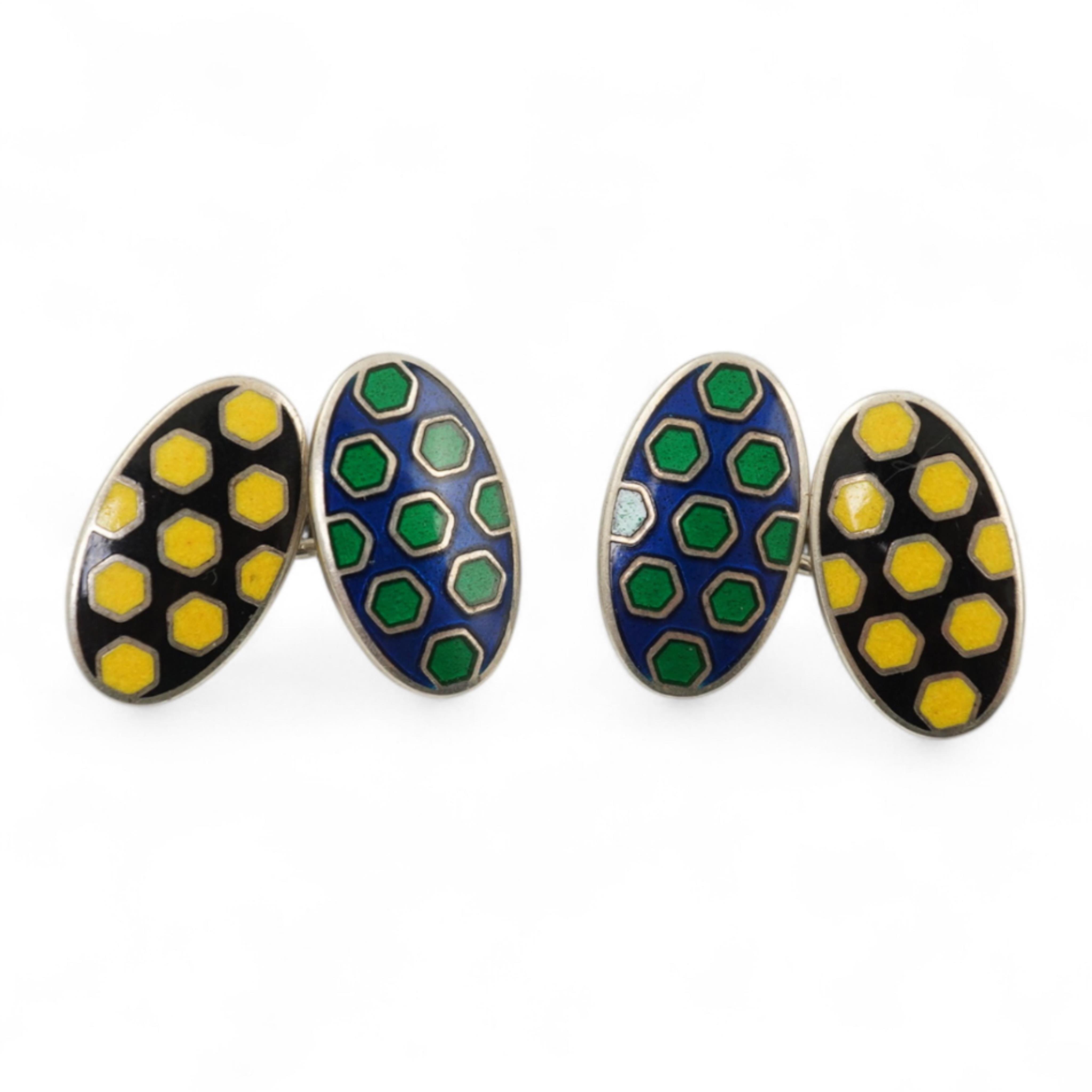A modern pair of silver and polychrome enamel set oval cufflinks, 18mm.